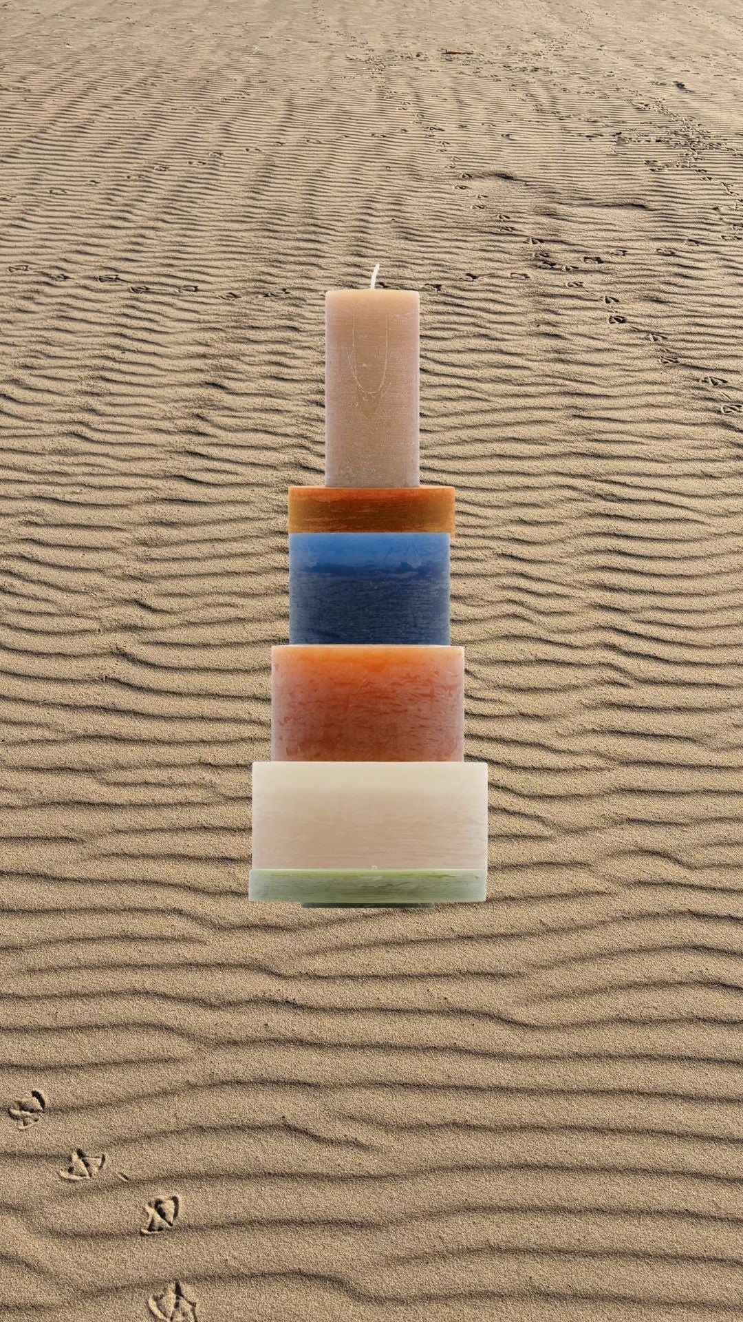 A Candl Stack set on rippled sand, bird tracks crossing the dunes